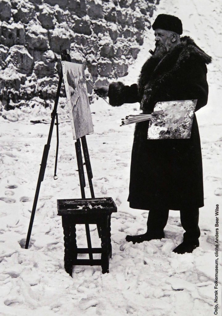 Photo de Frits Thaulow peignant en extérieur, dans la neige